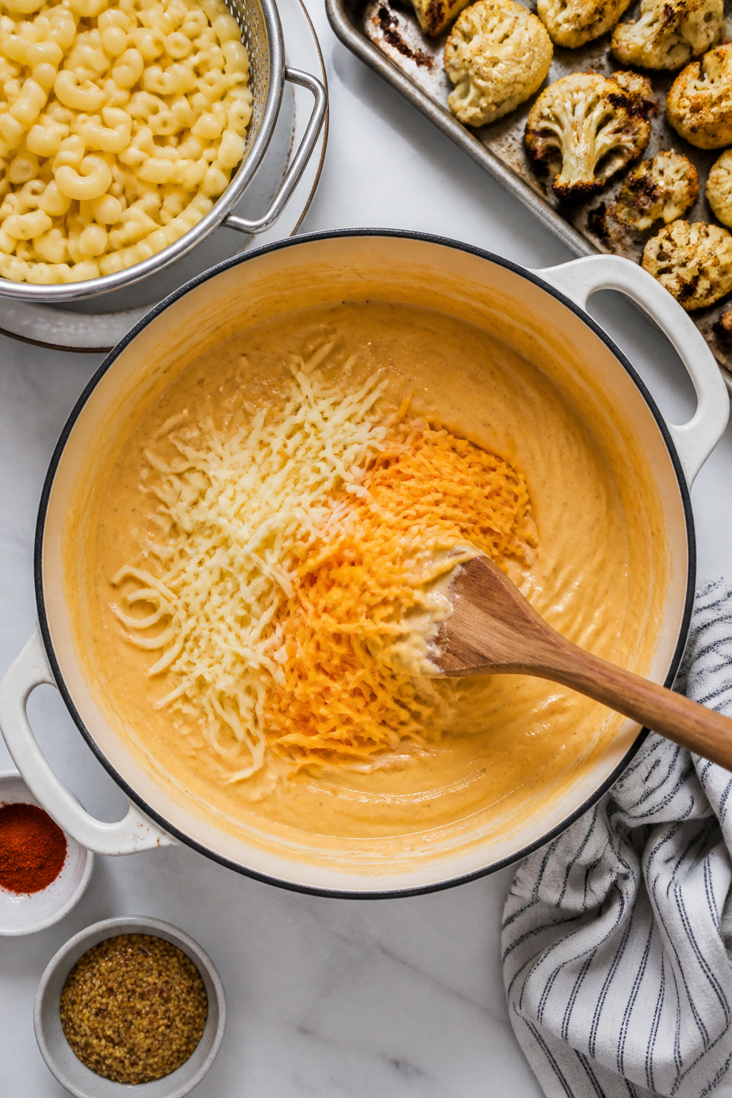 Cooking process: Overhead shot of the stovetop cheese sauce moment—thick, glossy béchamel in a wi