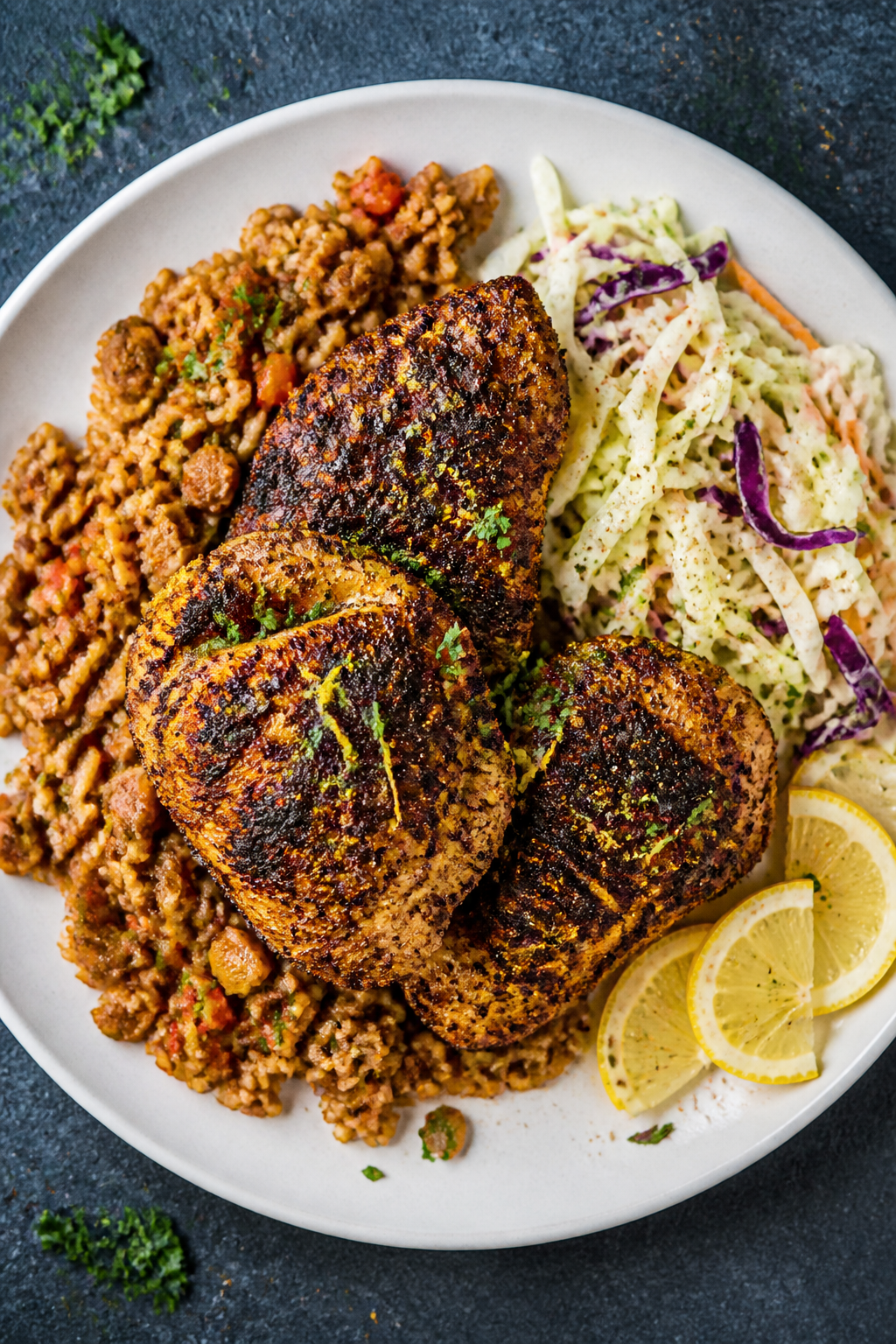 Final dish presentation: Restaurant-quality plate of crispy Cajun chicken thighs served with Cajun d