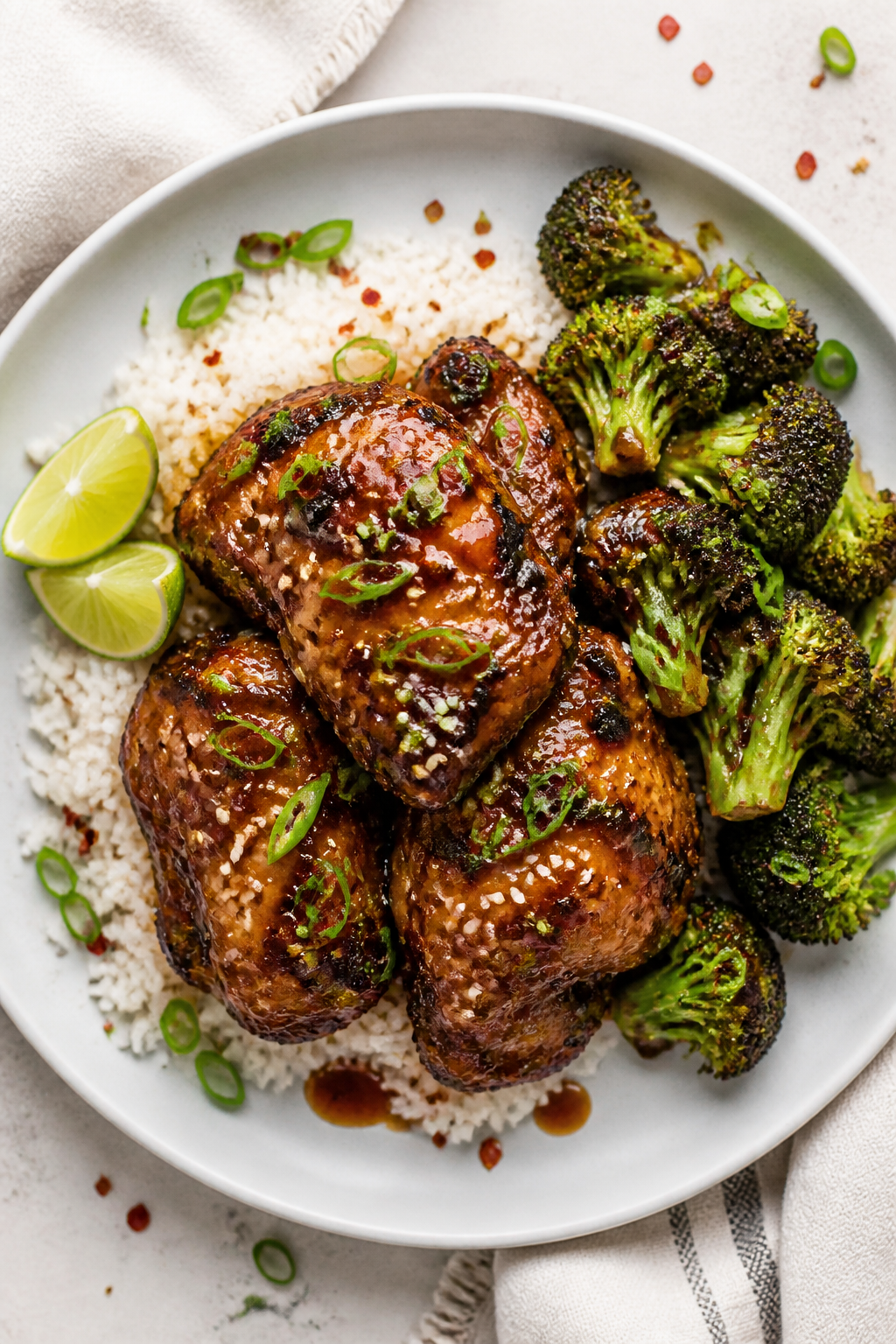 Final plated dish: Restaurant-quality presentation of Sweet and Spicy Honey Chicken Thighs served wi