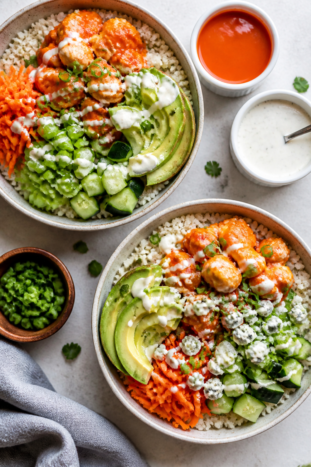Tasty top view — Assembling Buffalo Ranch Cauliflower Rice Bowls: Overhead shot of two bowls mid-b