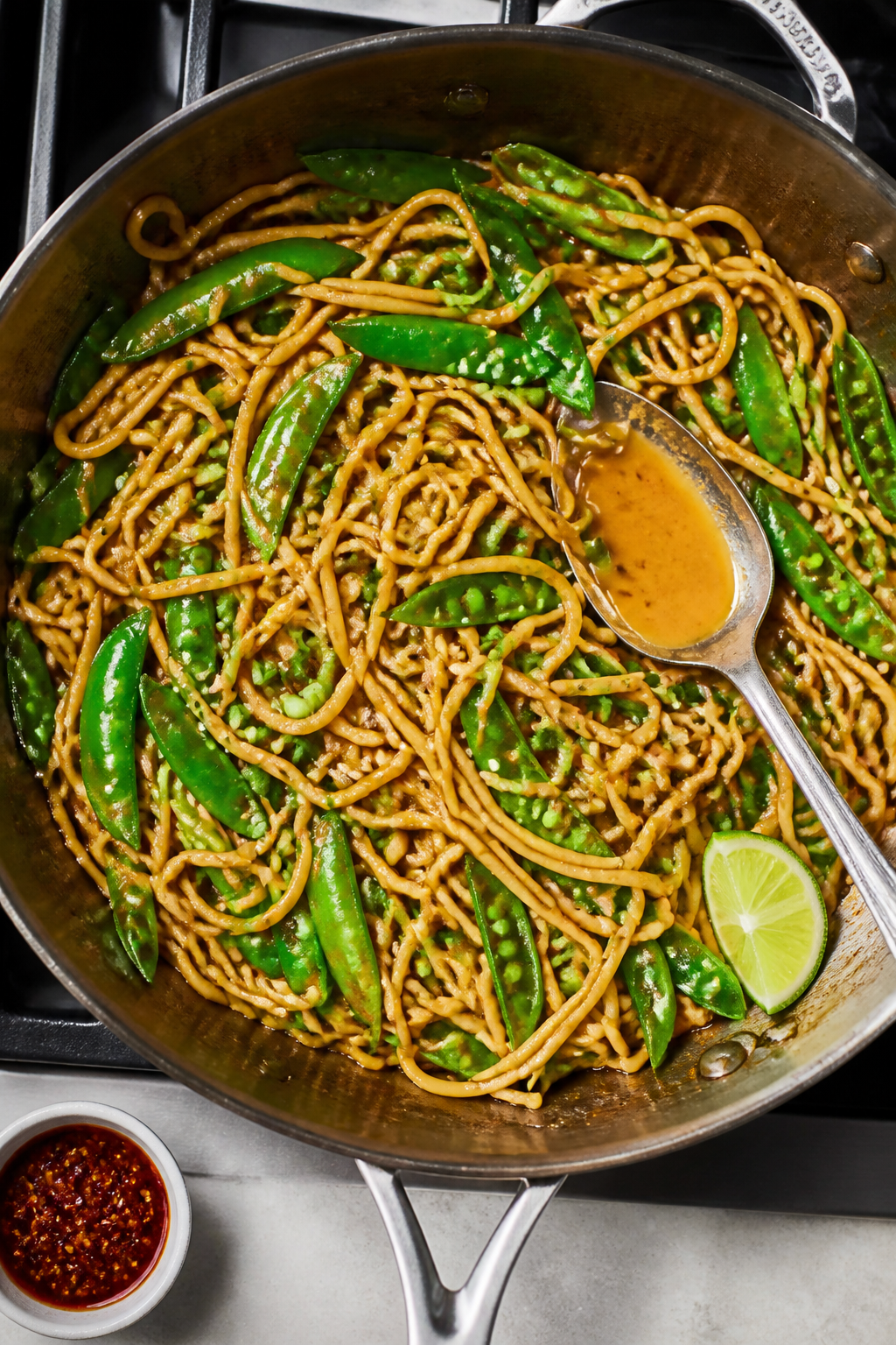 Tasty top view: Overhead shot of the completed noodles just after tossing in the pan—noodles evenl