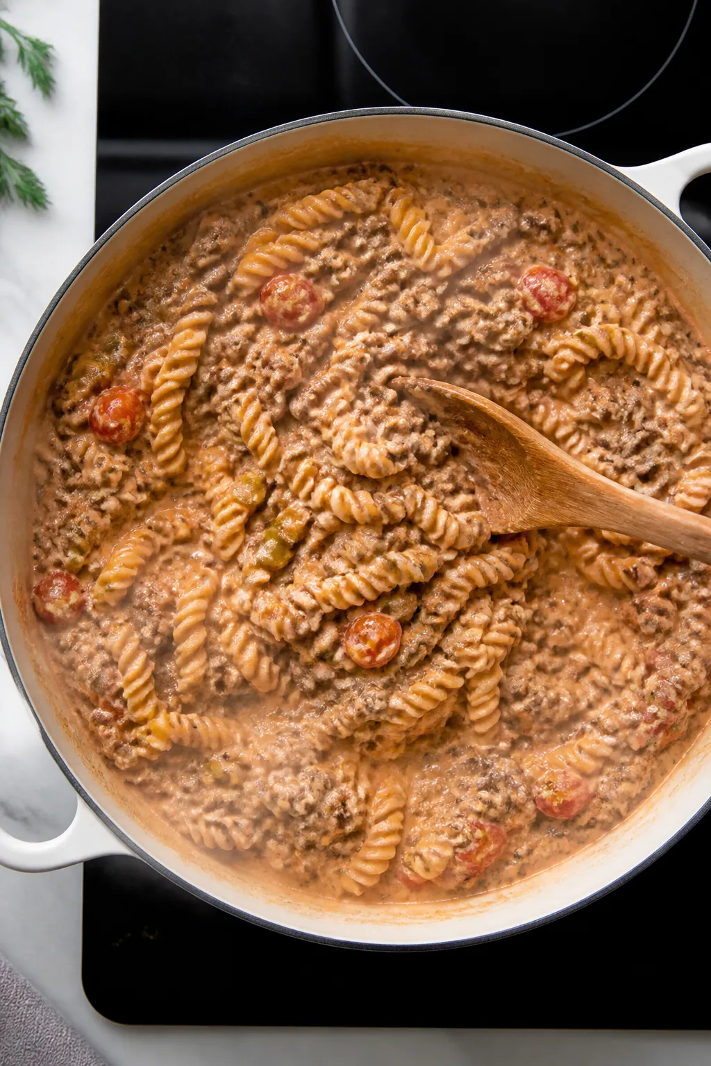 Cooking process: Overhead shot of the creamy “burger” beef mixture in a large skillet right afte